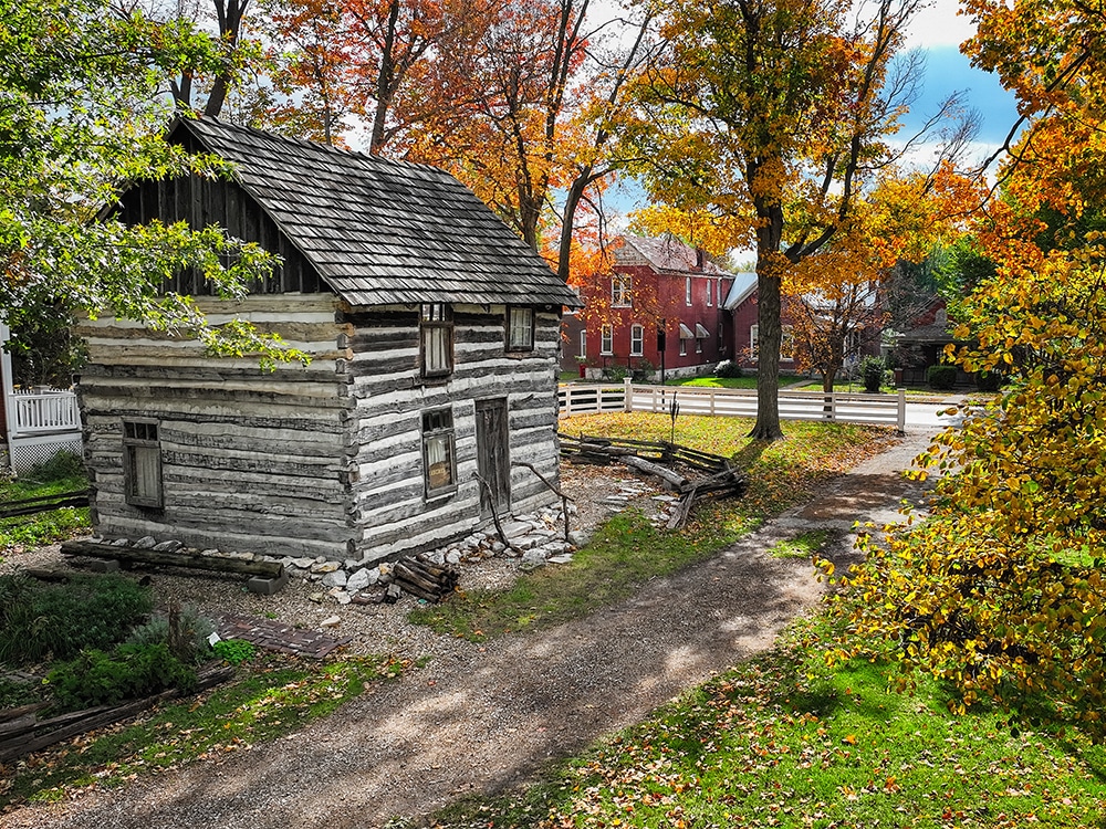 An aerial view of the 1830s log cabin on the John Wood Mansion site.