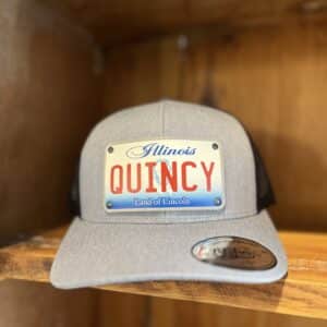 grey and black trucker style baseball hat with Quincy, IL license plate