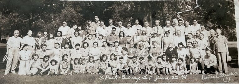 The small child with her mother in the center of the picture is one of the few people who remained in Quincy.